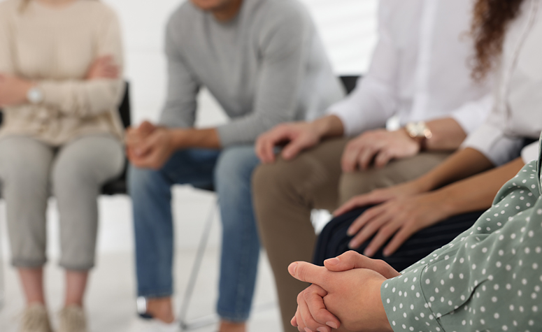 People meeting a support group for addicts
