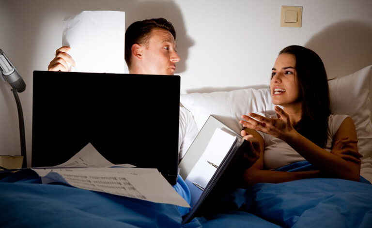 Couple arguing over husbands workaholic addiction impacting on their personal life