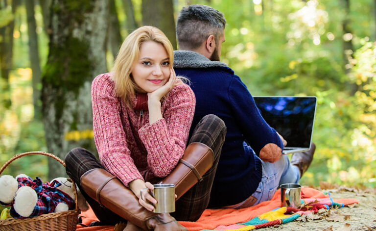 Husband still continues to work whilst on day trip to forest with his wife demonstrating workaholism problems