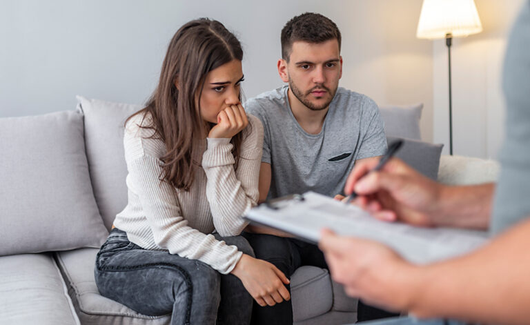 Couple in cognitive therapy session discussing shopping addiction treatment