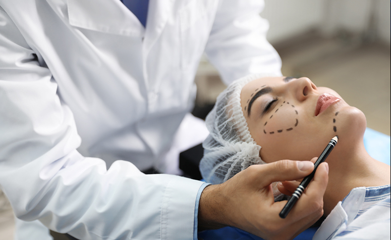 Surgeon prepares woman for plastic surgery