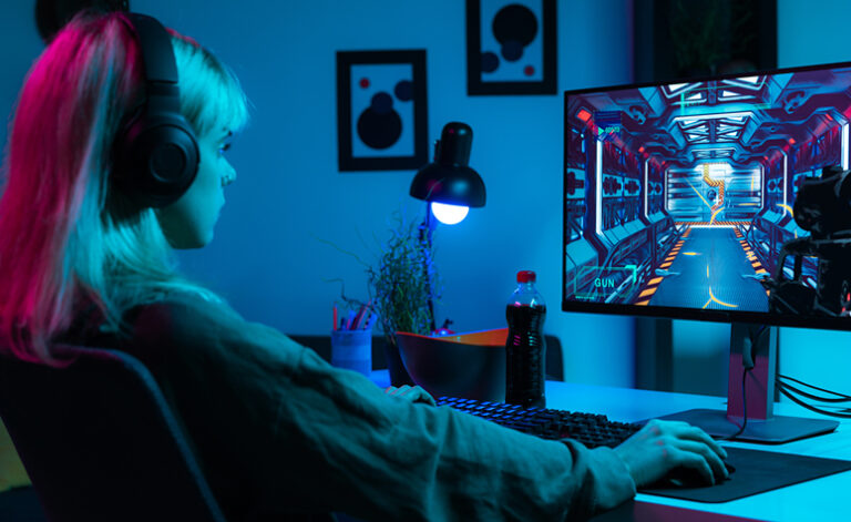 Girl playing on computer games all night suffering from gaming addiction issues