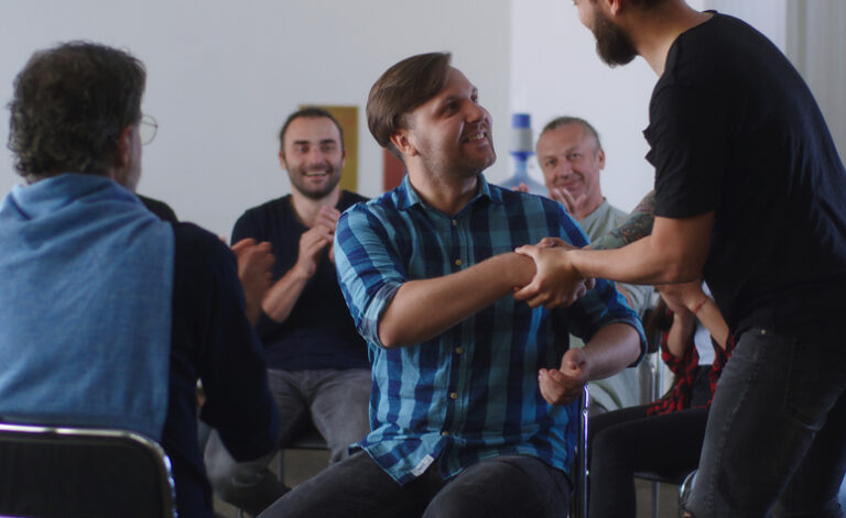 Group of recovering addicts meeting at an NA meeting