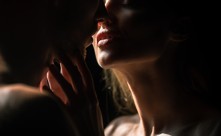 Love addicted woman kissing man