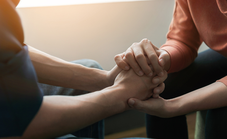 Man been comforted during individual therapy session while at addiction rehab center