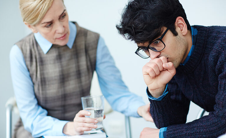Man in therapy session at treatment center for addiction to porn