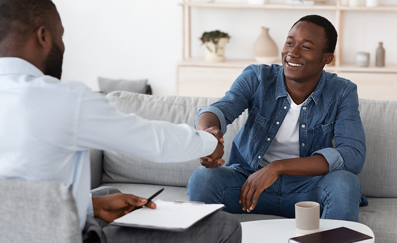 Man seeing a psychotherapist as part of his addiction rehab treatment programme