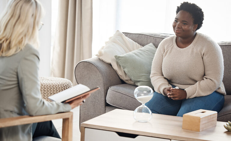 Woman in treatment therapy session with counsellor for food addiction