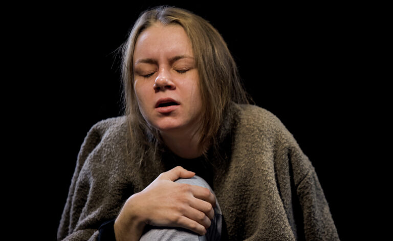 Woman suffering from drug withdrawal symptoms