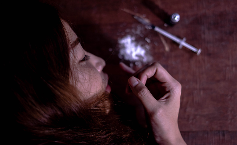 Woman suffering from drug addiction
