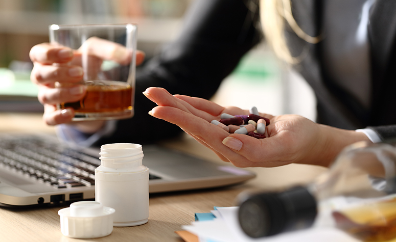 Woman with dual addiction taking alcohol and drugs