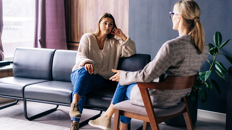 Women sat with psychiatrist in acceptance therapy session