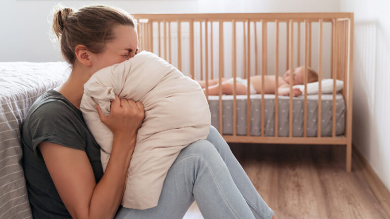 Young mother stressed and depressed with the pressures of motherhood