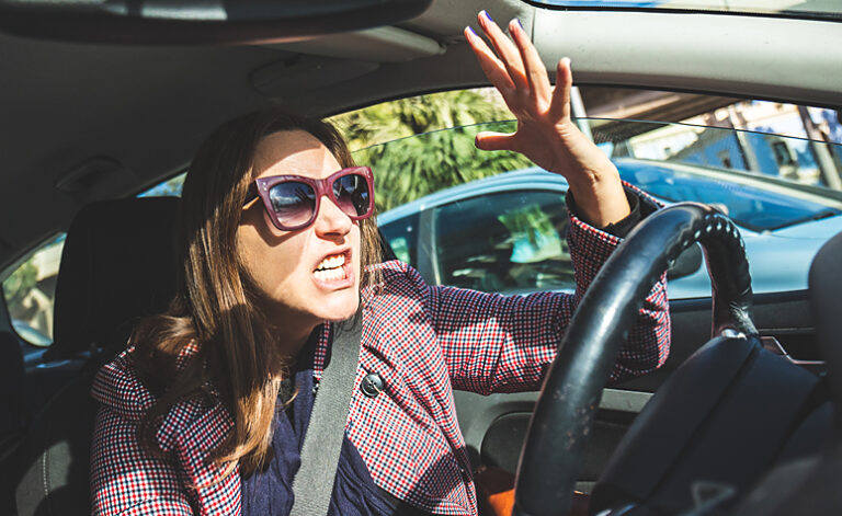 Woman acting out in uncontrollable anger - road rage