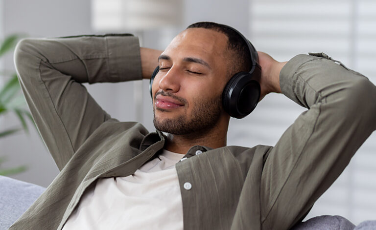Man relaxing listening to music as part of the recovery treatment process