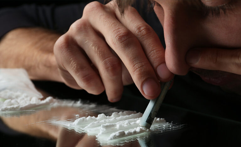 Man snorting cocaine