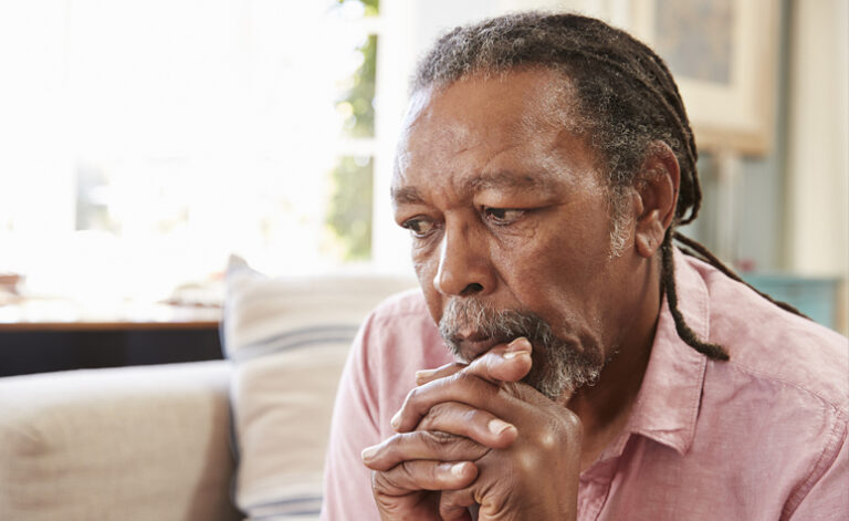 Man sat struggling with the effects of adjustment disorder