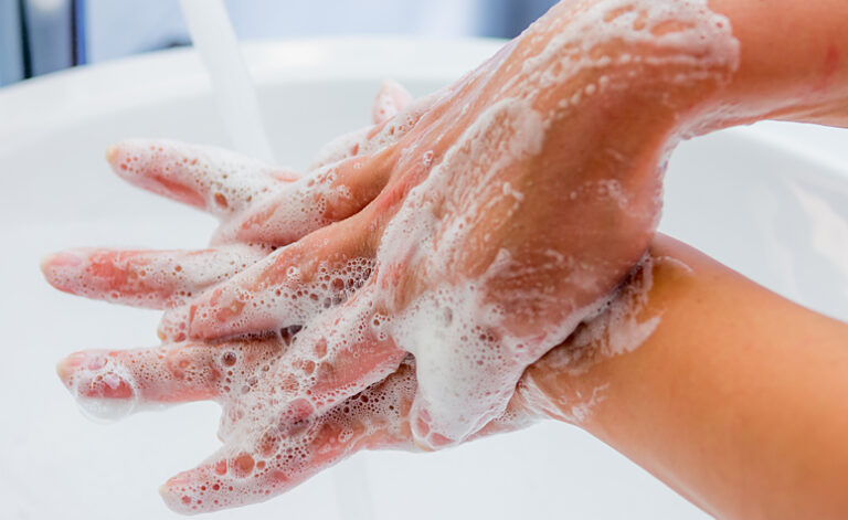 Woman washing her hands repeatedly due to OCD