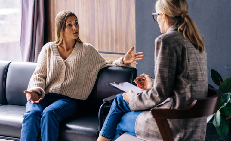 Woman participating in CBT therapy with psychiatrist for agoraphobia