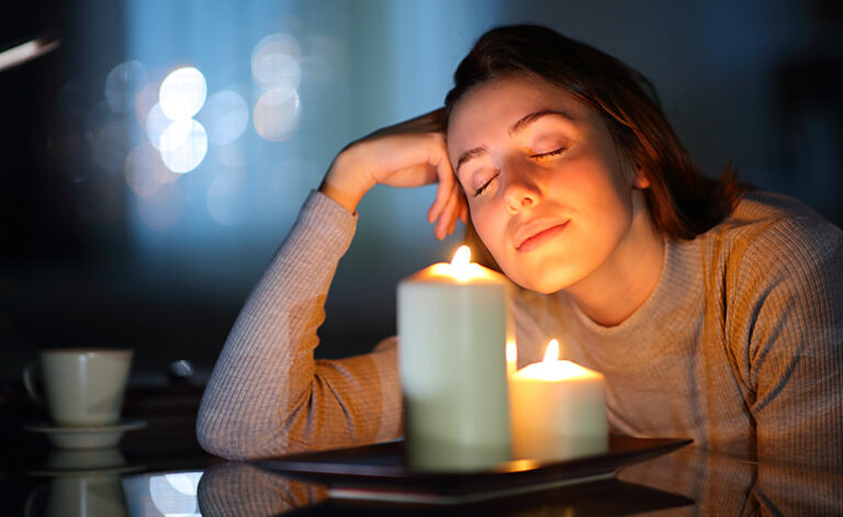 Woman relaxing using holistic therapy methods at home as part of her recovery journey