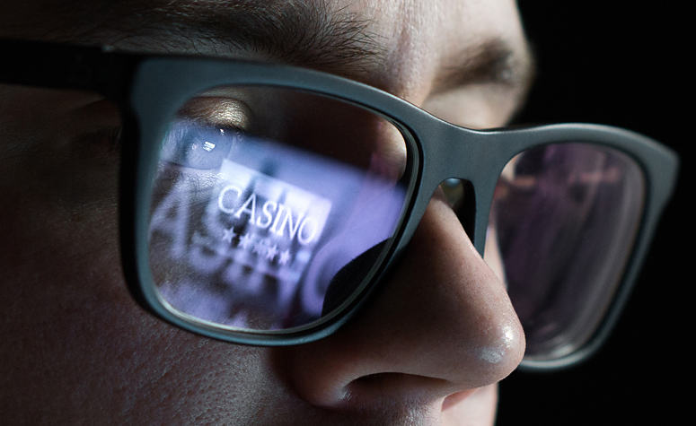 Man with a gambling addiction intensely focussing