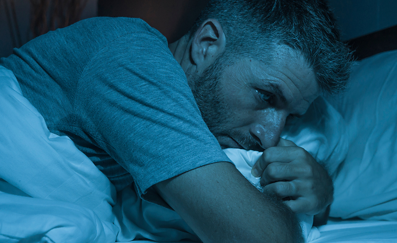 Man struggling with insomnia and other crack withdrawal symptoms during detox