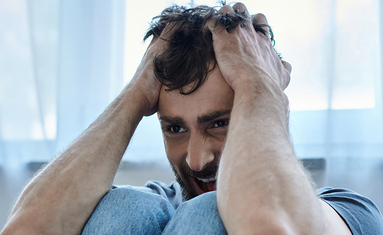 Man suffering with withdrawal symptoms during a cannabis detox