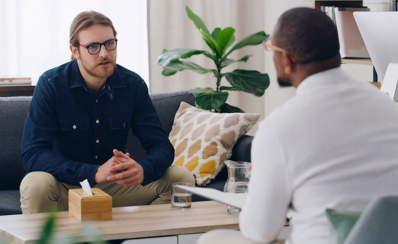 Man discussing with a therapist his ADHD symptoms