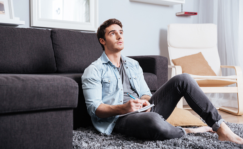 Man sat on the follow trying to figure out living with ADHD