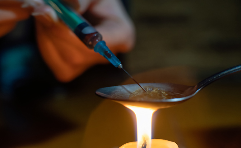 Cooking up heroin on a spoon