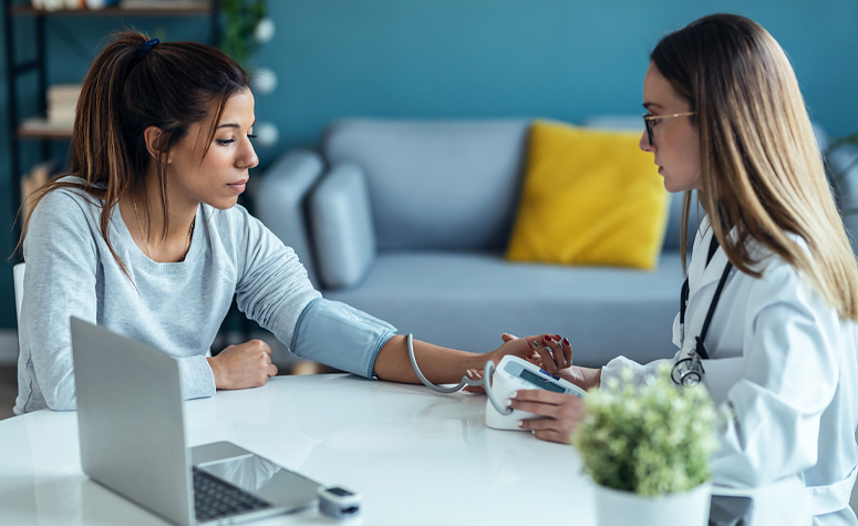 Woman having medical checks and blood pressure taken during ketamine detox