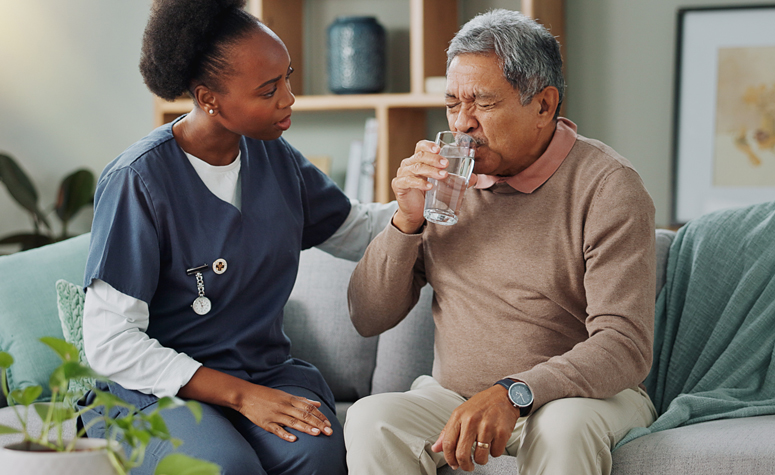 Rehab nurse helping a patient through the initial detoxification process in a rehab treatment centre