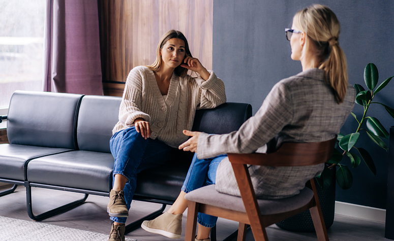 Trauma therapist working with a patient through her symptoms