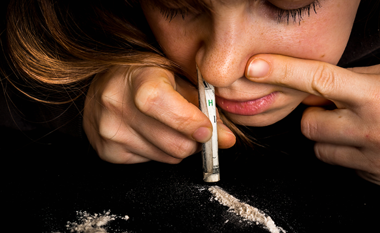 Woman snorting crack cocaine