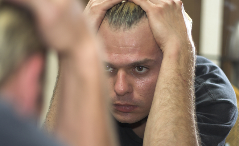 Man struggling with the symptoms of his addiction to PCP