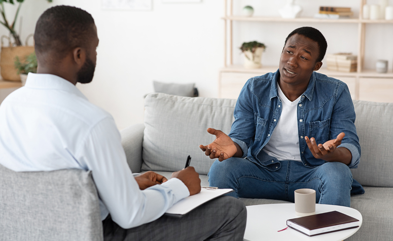 Man working with a therapist to work through his addiction to Lorazepam