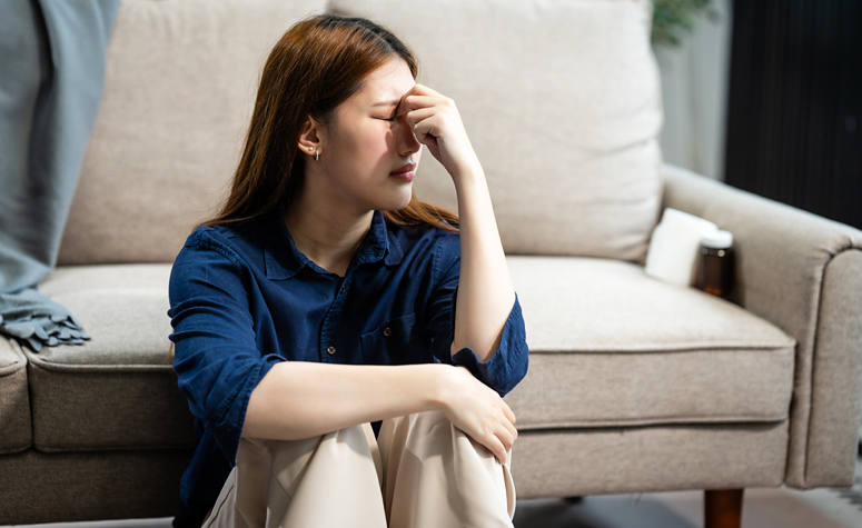 Woman suffering with depression due to her Tourette's syndrome